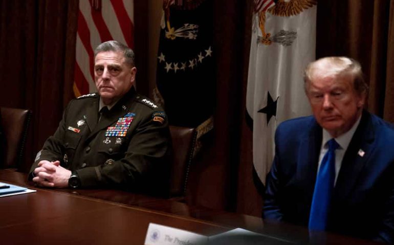 FILE  General Mark Milley of the Joint Chiefs of Staff and President Donald Trump in a meeting at the White House in Washington, May 9, 2020. Trumps refusal to commit to a peaceful transfer of power after the November election and his expressed desire in June to send active-duty troops onto American streets to quell protests has incited deep anxiety among senior military and Defense Department leaders. (Anna Moneymaker/The New York Times)