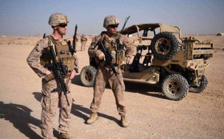 (FILES) In this file photo taken on August 27, 2017 US Marines keep watch as unseen Afghan National Army soldiers participate in an IED (improvised explosive device) training exercise at the Shorab Military Camp in Lashkar Gah in the Afghan province o