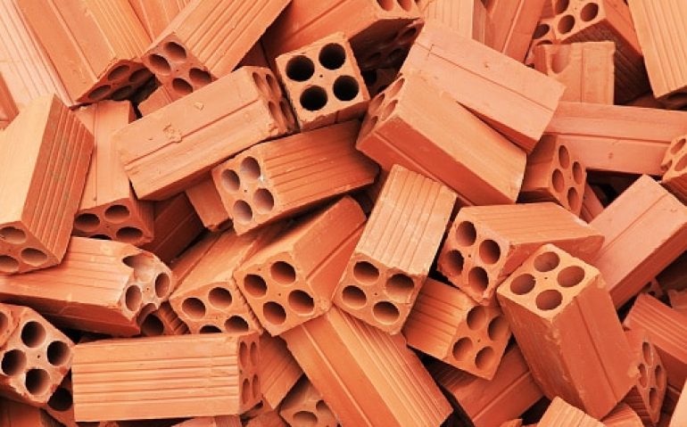group of bricks square construction materials. pile of red bricks.